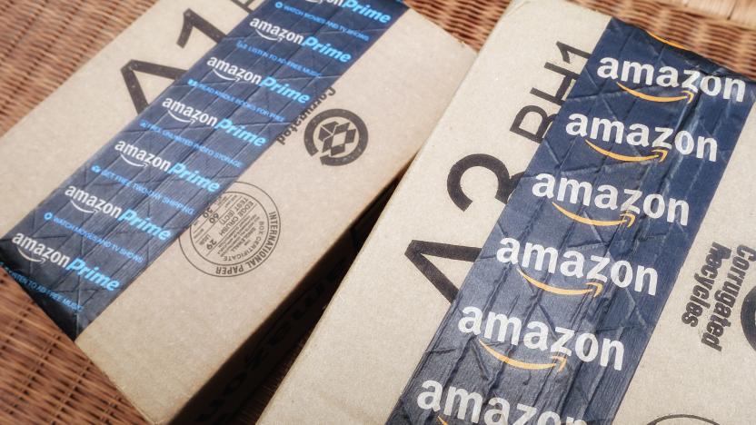 West Palm Beach, USA - June 30, 2016: Amazon packing tape on Amazon.com shipping boxes. One box is taped with Amazon Prime tape and the other has Amazon with the smiling arrow design. 