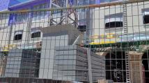 See Jones AT&T Stadium south end zone building's exterior during construction