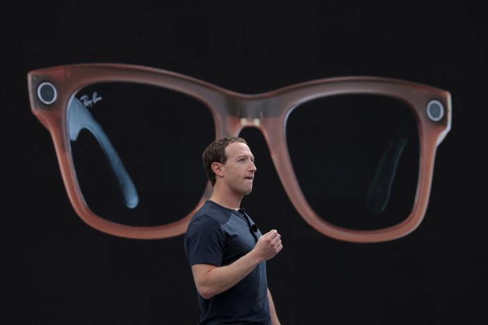 FILE PHOTO: Meta CEO Mark Zuckerberg delivers a speech, as a pair of Ray-Ban smart glasses appear on screen, during the Meta Connect event at the company's headquarters in Menlo Park, California, U.S., September 27, 2023. REUTERS/Carlos Barria/File Photo