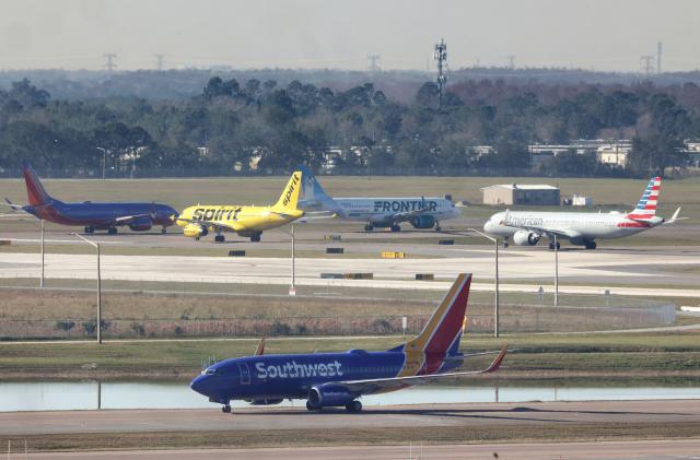 Airliners wait for takeoff in a queue at runways 36L and 36R at Orlando International Airport, Wednesday, Jan. 11, 2023, after the FAA grounded all U.S. flights earlier in the day. Flights were grounded nationwide for the first time since the Sept. 11, 2001, terrorist attack on the U.S., reportedly due to an FAA computer system failure. (Joe Burbank/Orlando Sentinel/Tribune News Service via Getty Images)
