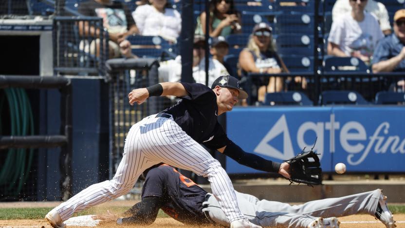 Apr 5, 2022; Tampa, Florida, USA; Detroit Tigers center fielder Victor Reyes (22) slides safe into third base as New York Yankees third baseman Josh Donaldson (28) attempted to tag him out during the fourth inning during spring training at George M. Steinbrenner Field. Mandatory Credit: Kim Klement-USA TODAY Sports