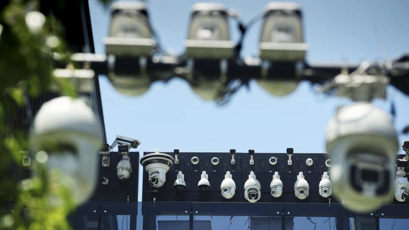 This picture shows Dahua surveillance cameras being installed on the Dahua Technologies office building in Hangzhou, in east China's Zhejiang province on May 29, 2019. (Photo by STR / AFP) / China OUT (Photo by STR/AFP via Getty Images)