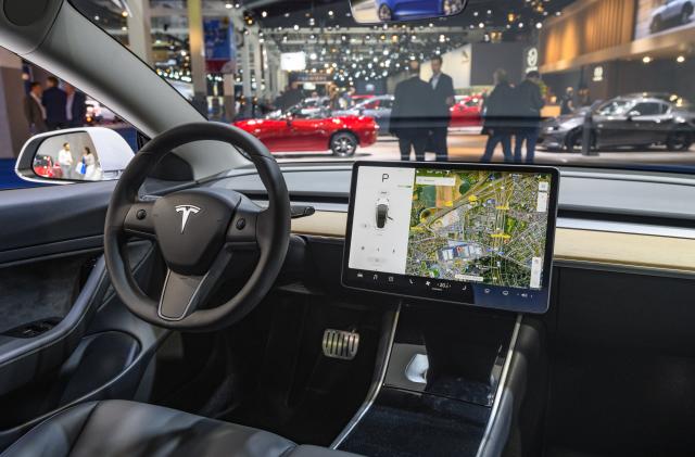 BRUSSELS, BELGIUM - JANUARY 09: Tesla Model 3 compact full electric car interior with a large touch screen on the dashboard on display at Brussels Expo on January 9, 2020 in Brussels, Belgium. The Model 3 is fitted with a full self-driving system. (Photo by Sjoerd van der Wal/Getty Images)