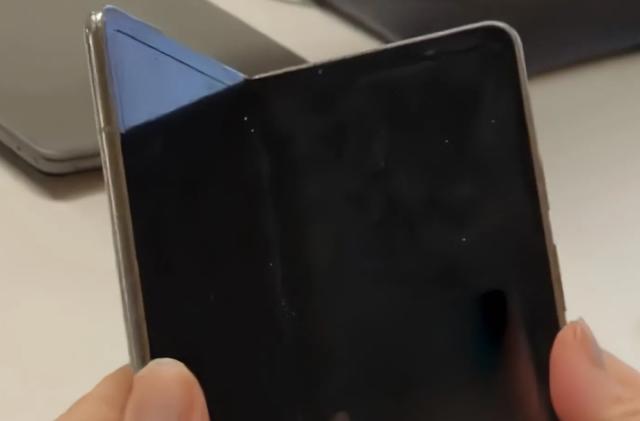 A screenshot from a recently leaked video of the Pixel Fold. The device features a book-like design with an internal display that has chunky bezels and a noticeable display crease.