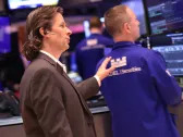 Nasdaq pulls off record close, Dow caps off tumultuous week