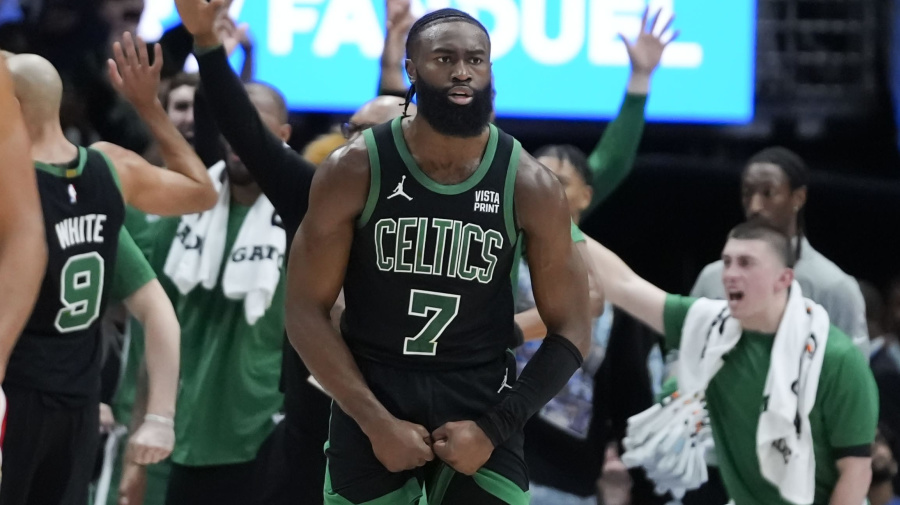 Associated Press - Boston Celtics guard Jaylen Brown (7) and the Celtics bench react after forward Jayson Tatum made a 3-point basket at the buzzer to end the first half of an NBA basketball game against the New Orleans Pelicans in New Orleans, Saturday, March 30, 2024. (AP Photo/Gerald Herbert)
