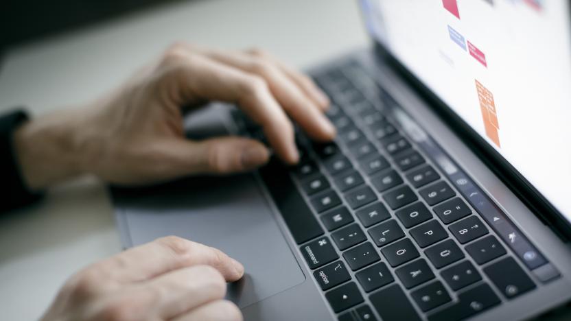 BERLIN, GERMANY - FEBRUARY 04: Symbol photo. A man is typing with his hands on a keyboard of a MacBook Pro on February 04, 2020 in Berlin, Germany. (Photo by Felix Zahn/Photothek via Getty Images)