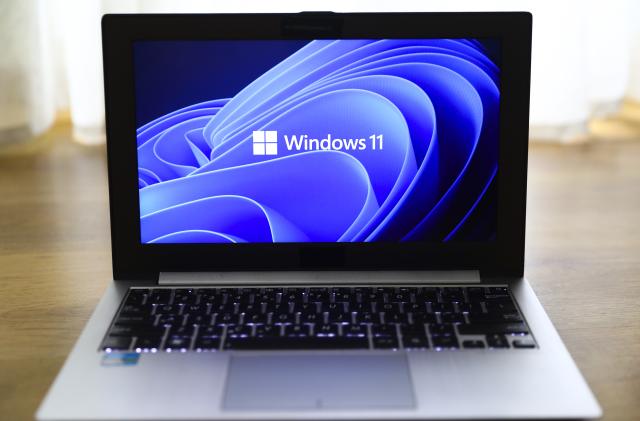 Windows 11 operating system logo is displayed on a laptop screen for illustration photo. Gliwice, Poland on January 23, 2022. (Photo by Beata Zawrzel/NurPhoto via Getty Images)