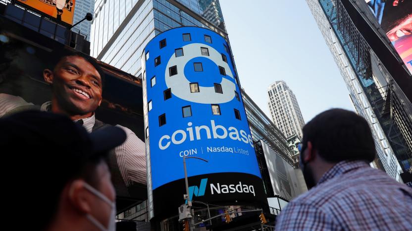 People watch as the logo for Coinbase Global Inc, the biggest U.S. cryptocurrency exchange, is displayed on the Nasdaq MarketSite jumbotron at Times Square in New York, U.S., April 14, 2021. REUTERS/Shannon Stapleton
