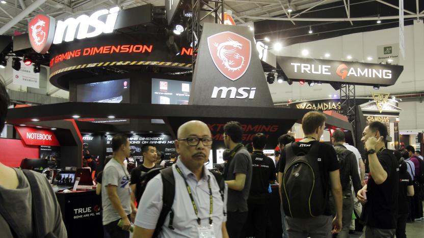 Visitors walk through the Computex Taipei exhibition at the world trade center in Taipei, Taiwan, Tuesday, May 30, 2017. (AP Photo/Chiang Ying-ying)