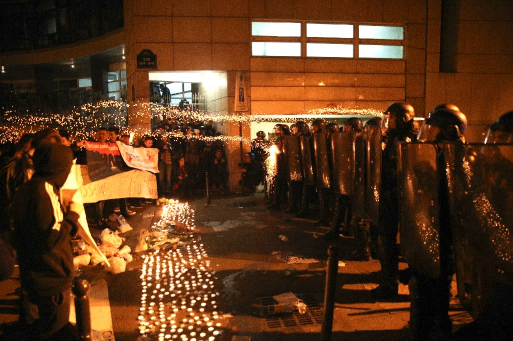 Family of Chinese man killed by Paris police calls for calm