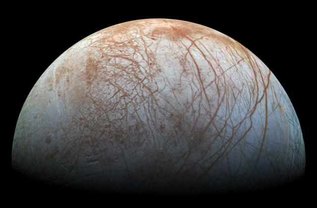 A new mosaic made from images taken by NASA's Galileo spacecraft in the late 1990's is shown of the surface of Jupiter's icy moon, Europa, as it looms large in this newly-reprocessed, higher resolution color view in this handout provided by NASA November 24, 2014. This newer version was created from images assembled into a realistic color view of the surface that approximates how Europa would appear to the human eye. NASA/JPL-Caltech/SETI Institue/Handout via Reuters  