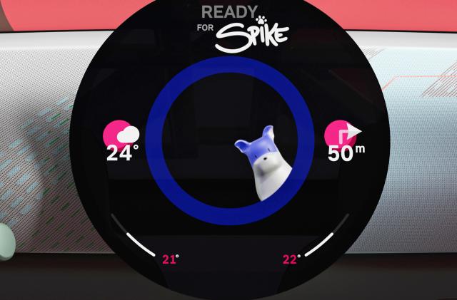 A round dashboard display showing the Mini's digital assistant Spike alongside icons for weather and driving directions.
