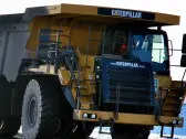 Caterpillar Inc. (NYSE:CAT) Looks Interesting, And It's About To Pay A Dividend