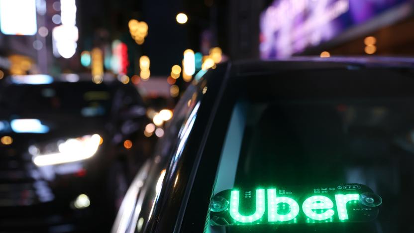 The logo for Uber Technologies is seen on a vehicle in Manhattan, New York City, New York, U.S., November 17, 2021. REUTERS/Andrew Kelly