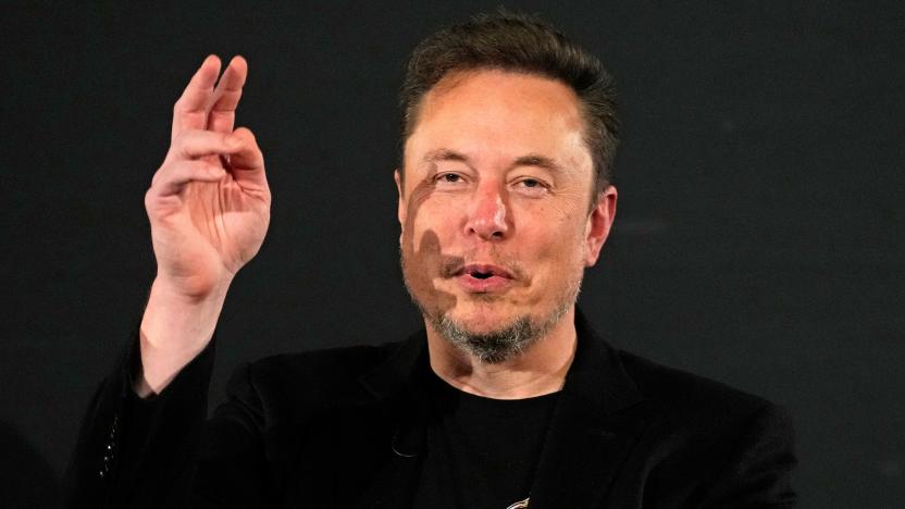 File - Elon Musk, owner of social media platform X, gestures during an event with Britain's Prime Minister Rishi Sunak in London on Nov. 2, 2023. IBM has stopped advertising on X after a report said its ads were appearing alongside material praising Adolf Hitler and Nazis. 