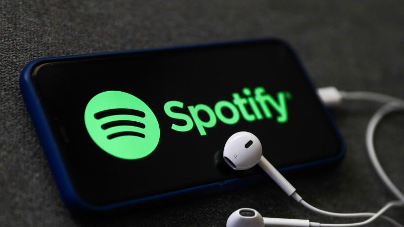 Spotify logo displayed on a phone screen and headphones are seen in this illustration photo taken in Poland on October 18, 2020. 
 (Photo Illustration by Jakub Porzycki/NurPhoto via Getty Images)