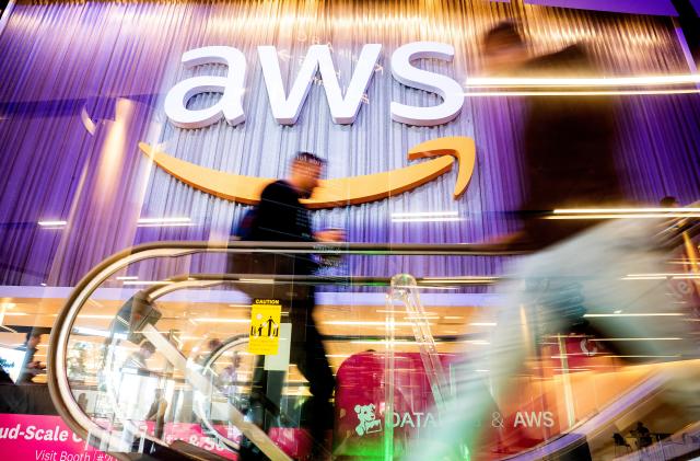 Attendees walk through AWS re:Invent 2022, a conference hosted by Amazon Web Services (AWS), in Las Vegas, Nevada, U.S., November 30, 2022. Noah Berger/AWS/Handout via REUTERS THIS IMAGE HAS BEEN SUPPLIED BY A THIRD PARTY. MANDATORY CREDIT