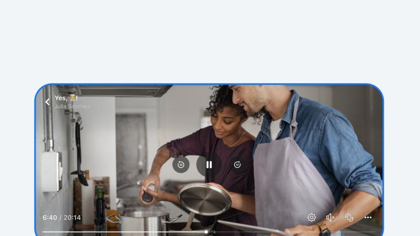 A video showing two people cooking takes up an entire screen. 