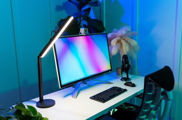 Logitech Litra Beam key light on a desktop next to a computer
