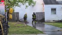 Electric car catches fire, spreads to house on Troy St. in Norfolk