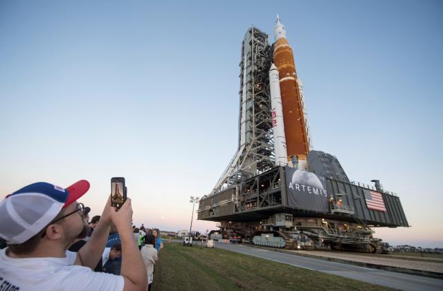 NASA's next-generation moon rocket, the Space Launch System (SLS) rocket with its Orion crew capsule perched on top, makes a highly anticipated, slow-motion journey from the Vehicle Assembly Building (VAB) to its launch pad at Cape Canaveral, Florida, U.S. March 17, 2022. Picture taken March 17, 2022. NASA/Aubrey Gemignani/Handout via REUTERS.  THIS IMAGE HAS BEEN SUPPLIED BY A THIRD PARTY.