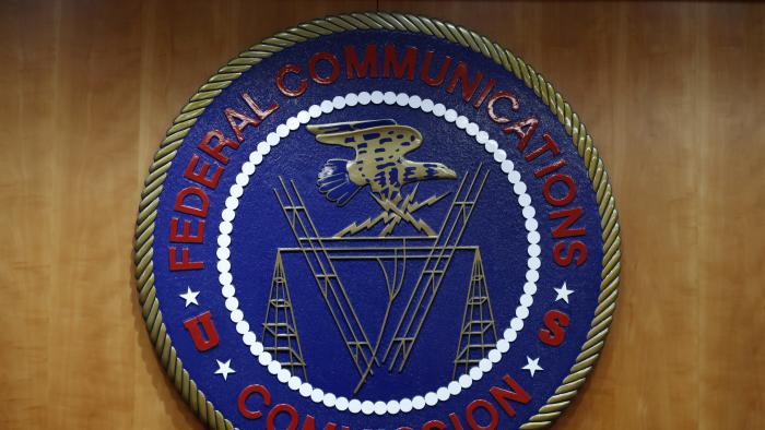 The seal of the Federal Communications Commission (FCC) is seen before an FCC meeting to vote on net neutrality in Washington, Thursday, Dec. 14, 2017. (AP Photo/Jacquelyn Martin)