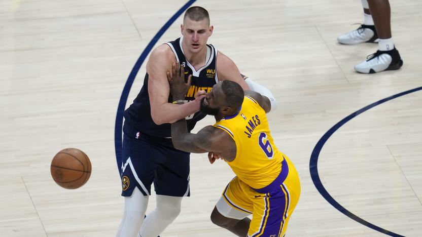 Los Angeles Lakers forward LeBron James (6) collides with Denver Nuggets center Nikola Jokic (15) during the second half of Game 2 of the NBA basketball Western Conference Finals series, Thursday, May 18, 2023, in Denver. (AP Photo/David Zalubowski)