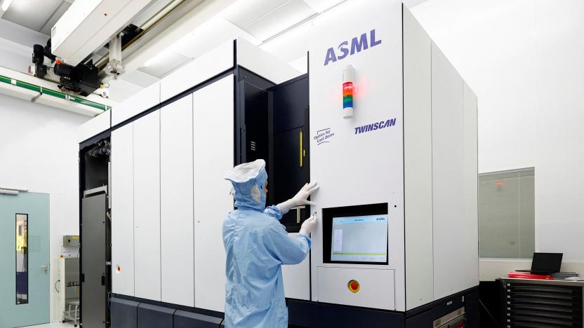 An assembly engineer works on a TWINSCAN DUV lithography system at ASML in Veldhoven, Netherlands June 16, 2023. REUTERS/Piroschka van de Wouw