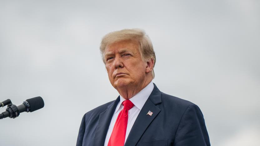 PHARR, TEXAS - JUNE 30: Former President Donald Trump looks on before speaking during a tour to an unfinished section of the border wall on June 30, 2021 in Pharr, Texas. Gov. Abbott has pledged to build a state-funded border wall between Texas and Mexico as a surge of mostly Central American immigrants crossing into the United States has challenged U.S. immigration agencies. So far in 2021, U.S. Border Patrol agents have apprehended more than 900,000 immigrants crossing into the United States on the southern border.  (Photo by Brandon Bell/Getty Images)