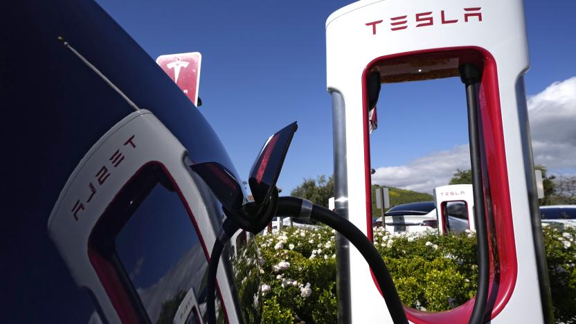 FILE - A Tesla auto charges on May 10, 2023, in Westlake, Calif. All of Ford Motor Co.'s current and future electric vehicles will have access to about 12,000 Tesla Supercharger stations starting in 2024, according to an announcement Thursday, May 25, 2023, by Ford CEO Jim Farley and Tesla CEO Elon Musk. (AP Photo/Mark J. Terrill, File)