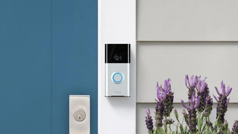 Product photo of a Ring doorbell mounted next to a home's front door.