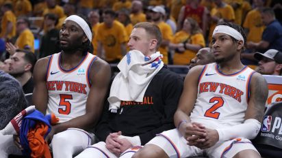 Associated Press - New York Knicks forward Precious Achiuwa, from left, guard Donte DiVincenzo and guard Miles McBride watch from the bench during the second half of Game 6 against the Indiana Pacers in an NBA basketball second-round playoff series, Friday, May 17, 2024, in Indianapolis. The Pacers won 116-103. (AP Photo/Michael Conroy)