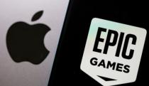 FILE PHOTO: Smartphone with Epic Games logo is seen in front of Apple logo in this illustration taken, May 2, 2021. REUTERS/Dado Ruvic/Illustration/File Photo