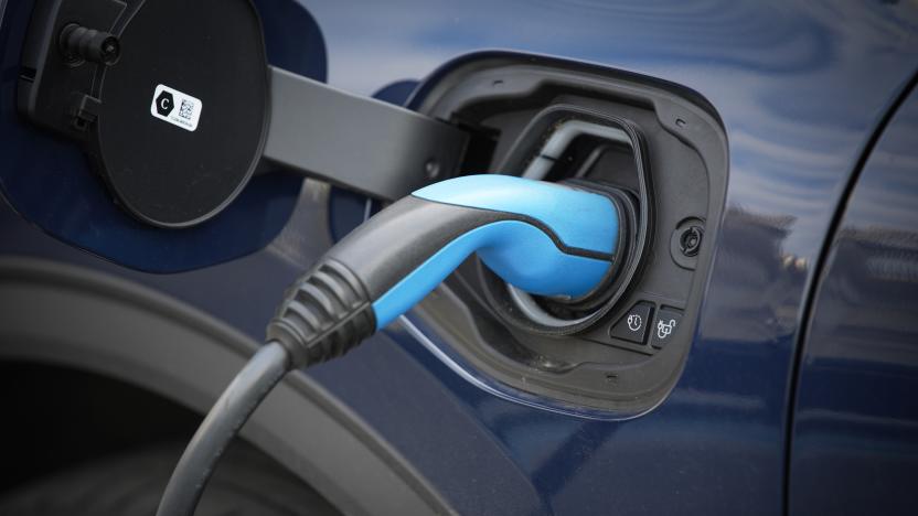 Detail of a Ford car is seen being charged via a cable from a charger in Warsaw, Poland on 14 June, 2022. (Photo by STR/NurPhoto via Getty Images)