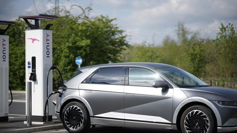 LEEDS, ENGLAND - APRIL 26: A Hyundai Ioniq battery electric vehicle (BEV) charges at an Ionity GmbH electric car charging station at Skelton Lake motorway service area on April 26, 2022 in Leeds, England. According to a report from the Society of Motor Manufacturers And Traders, there were more new electric vehicle registrations in the UK in March 2022 than all of 2019. However, overall car sales slumped amid rising fuel prices and the car industry's supply chain problems. (Photo by Christopher Furlong/Getty Images)