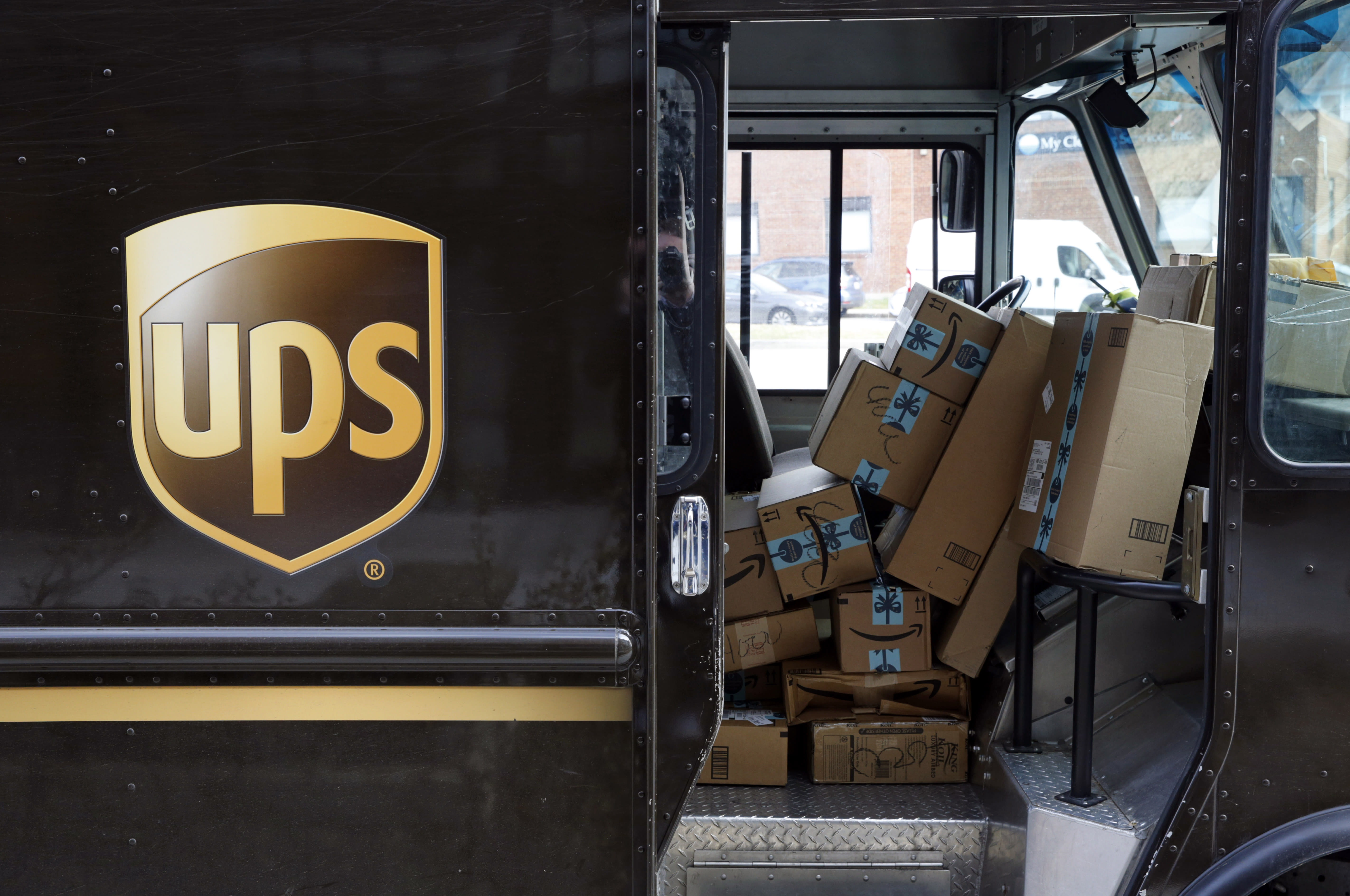 UPS' profit slips, but results top expectations, shares rise