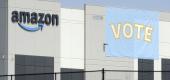 A banner encouraging workers to vote in labor balloting is shown at an Amazon warehouse in Bessemer, Ala.  (AP)