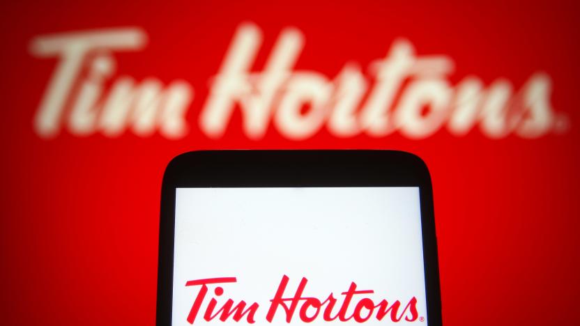 UKRAINE - 2021/08/25: In this photo illustration a Tim Hortons logo of a multinational fast food restaurant chain is seen on a smartphone and a pc screen. (Photo Illustration by Pavlo Gonchar/SOPA Images/LightRocket via Getty Images)