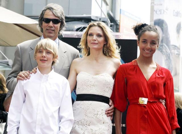 Michelle and her fam, also including son John, getting a star on the Hollywood Walk of Fame in 2007. (Photo: Kevin Winter/Getty Images)