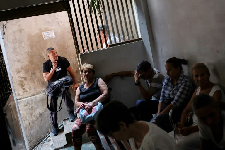 Patients wait at the spiritual healer's clinic in Petare (AFP Photo/Matias Delacroix)