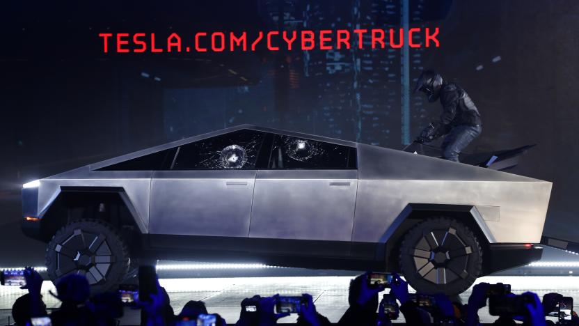 The Tesla Cybertruck and electric all-terrain vehicle (ATV) are unveiled at Tesla's design studio Thursday, Nov. 21, 2019, in Hawthorne, Calif. CEO Elon Musk is taking on the workhorse heavy pickup truck market with his latest electric vehicle. (AP Photo/Ringo H.W. Chiu)