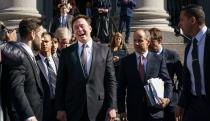 Elon Musk standing in front of a federal building, laughing maniacally, surrounded by men in suits.