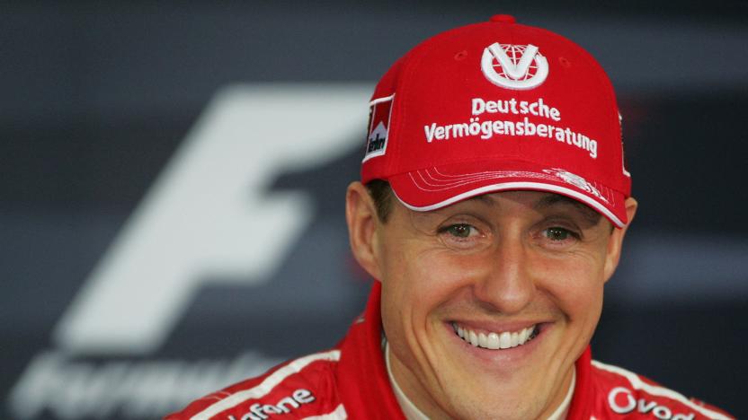 German Ferrari driver Michael Schumacher smiles during a press conference after the qualifiying session of the Bahrain Formula One Grand Prix at Sakhir racetrack, 11 March 2006, in Manama. AFP PHOTO DAMIEN MEYER (Photo by Damien MEYER / AFP) (Photo by DAMIEN MEYER/AFP via Getty Images)