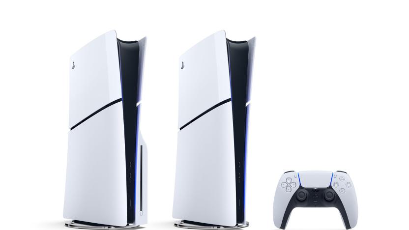 Sony marketing photo of two PS5s with round metal stands and a controller against a white background.