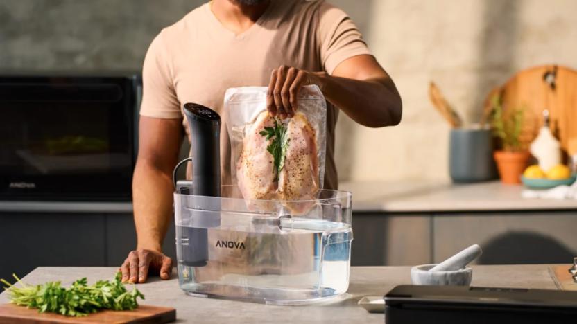 A guy cooking something with a sous vide machine.