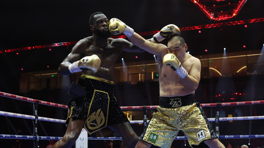 Getty Images - RIYADH, SAUDI ARABIA - JUNE 01: Zhilei Zhang (Gold shorts) and Deontay Wilder (Black shorts) box during their Heavyweight contest on June 1, 2024 in Riyadh, Saudi Arabia. (Photo by Mark Robinson/Matchroom Boxing/Getty Images)