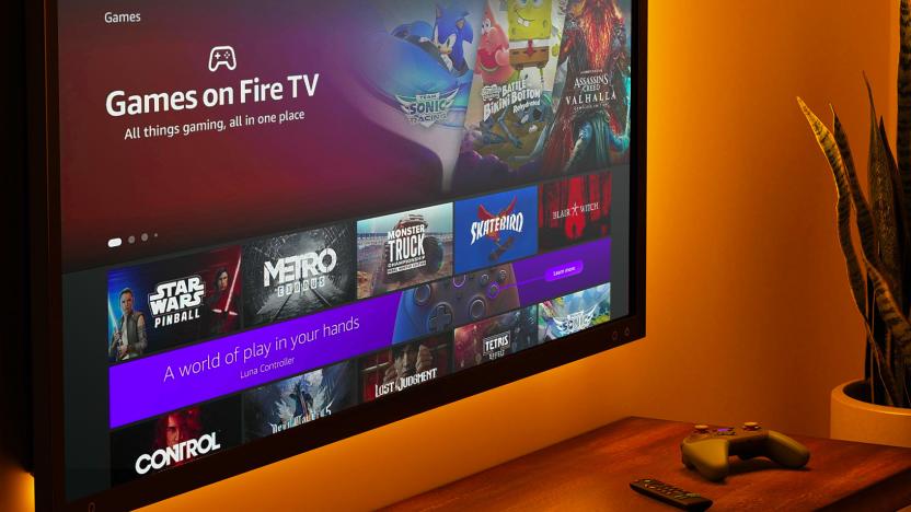 Amazon lifestyle marketing photo of a Fire TV mounted on a wall. The screen says "Games on Fire TV" with various options in a grid of rectangles.