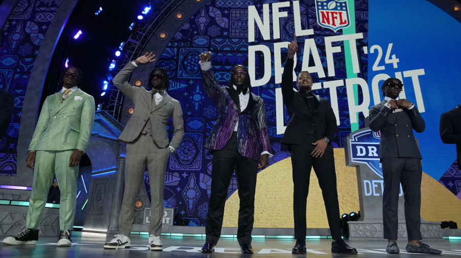 Associated Press - Top prospects stand on stage before the first round of the NFL football draft, Thursday, April 25, 2024, in Detroit. (AP Photo/Jeff Roberson)