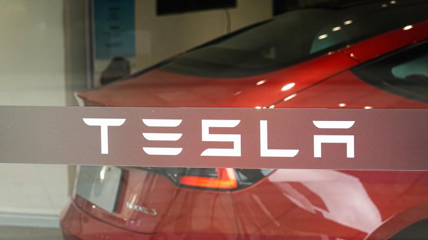 CHANGZHOU, CHINA - 2022/04/29: The Tesla logo is seen on the store's glass window. (Photo by Sheldon Cooper/SOPA Images/LightRocket via Getty Images)